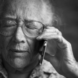 woman with sudden hearing loss on the phone