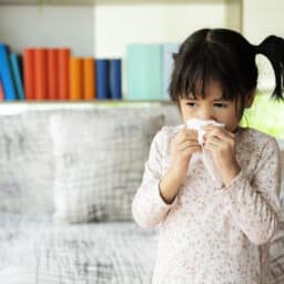 Little girl with a runny nose.