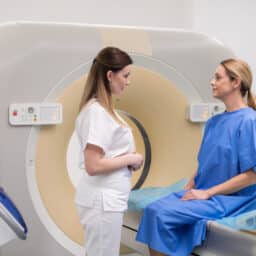 Doctor explaining the process of a CT scan to her patient