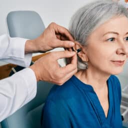 Senior woman getting her first hearing aid